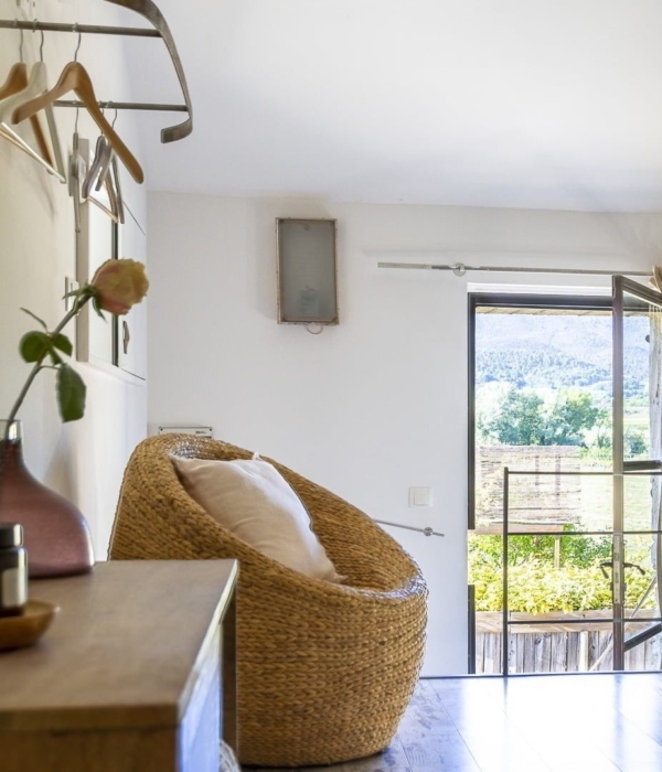 a living room filled with furniture and a window