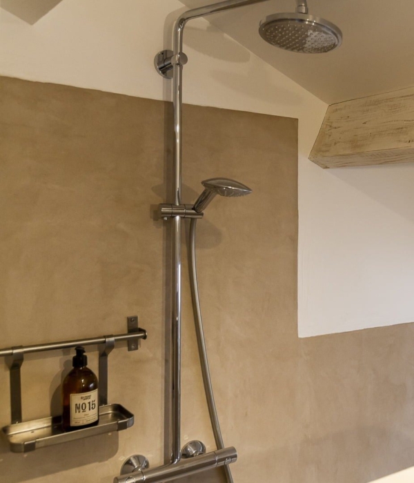 a bathroom with shower and sink