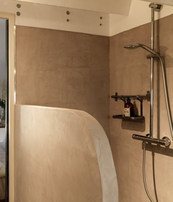 a bathroom with shower and bed