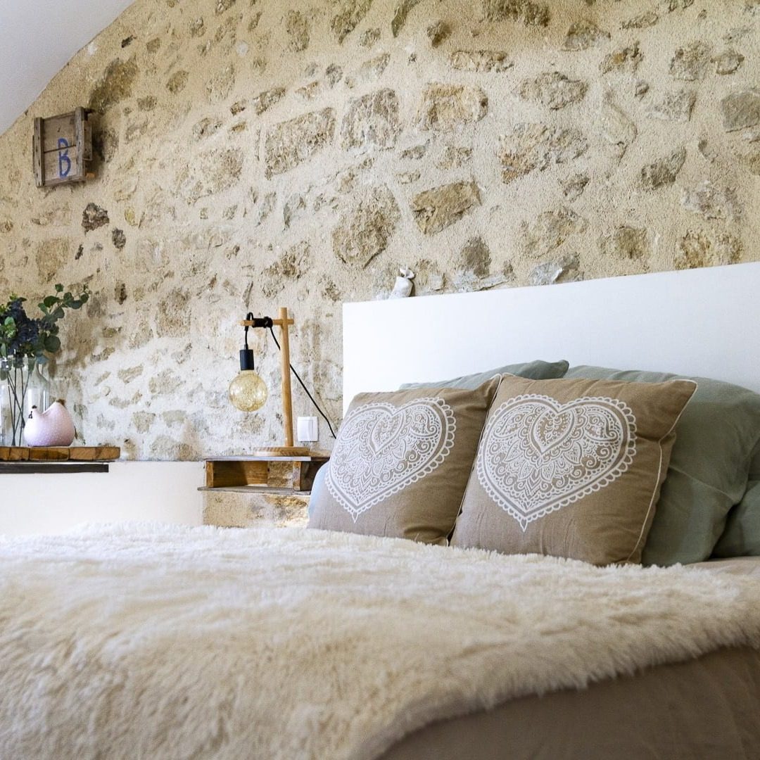 a bedroom with a large bed and a large window