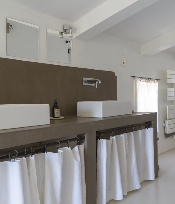 a kitchen with a white counter and a white sink