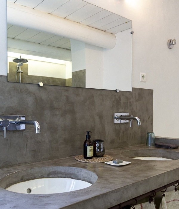 a bathroom with sink and mirror