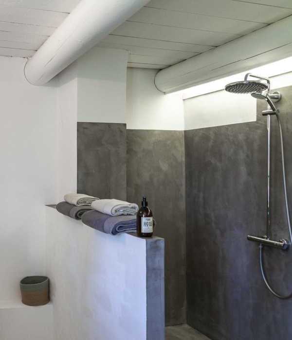 a bathroom with sink, toilet and shower