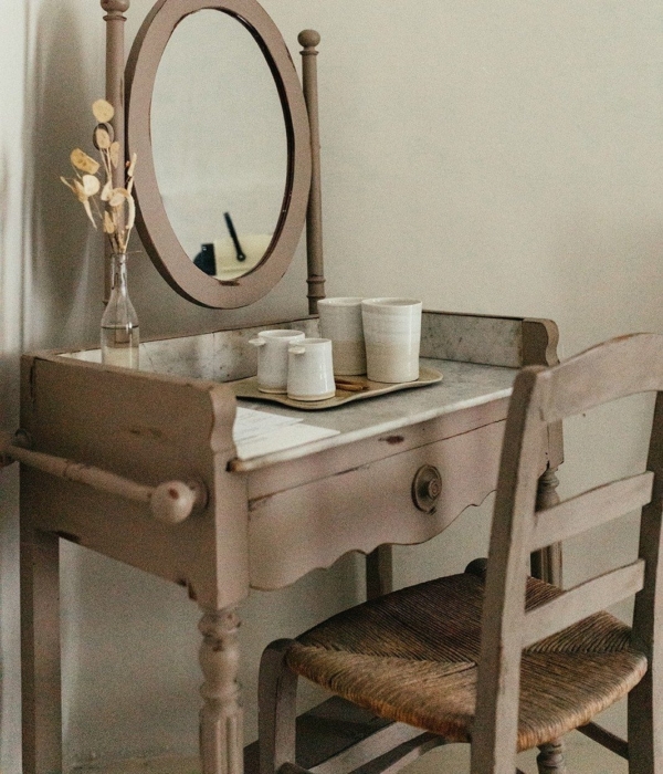a wooden table with a mirror on it