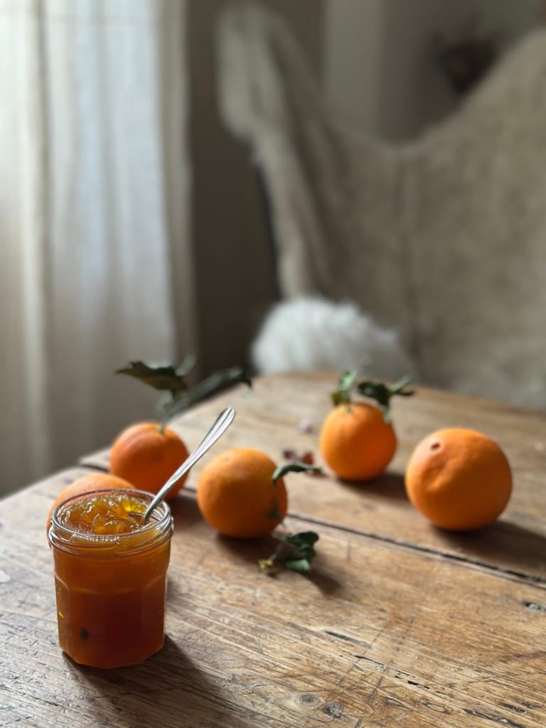 Delicious candied citrus peel on a rustic wooden table.