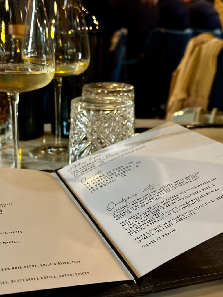 Restaurant menu with food and drinks, warm and friendly atmosphere.