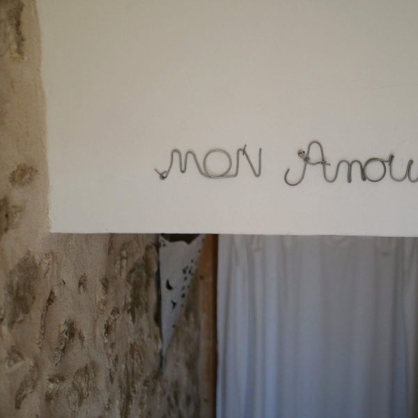 a sign on the wall with a picture of a penguin on it
