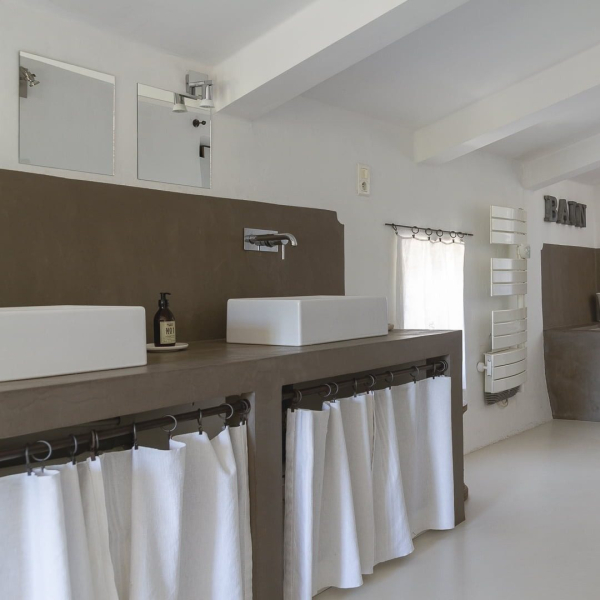 a kitchen with a white counter and a white sink