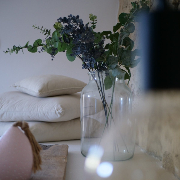 a table with a vase of flowers on it