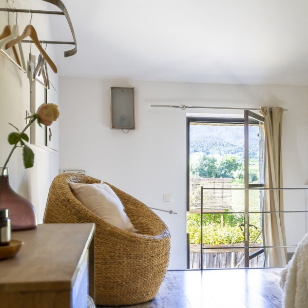 a living room filled with furniture and a window